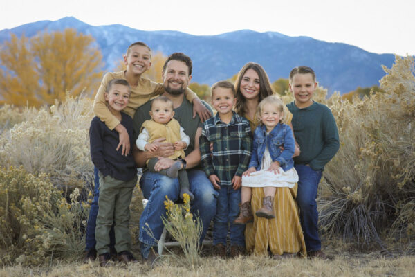 Hanson Family picture with mountains in the background.